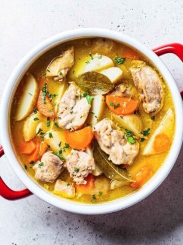 a pot with chicken stew and potatoes