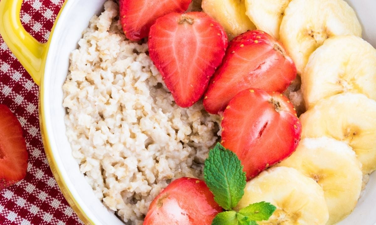 a bowl of quick oats topped with berries and banana slices