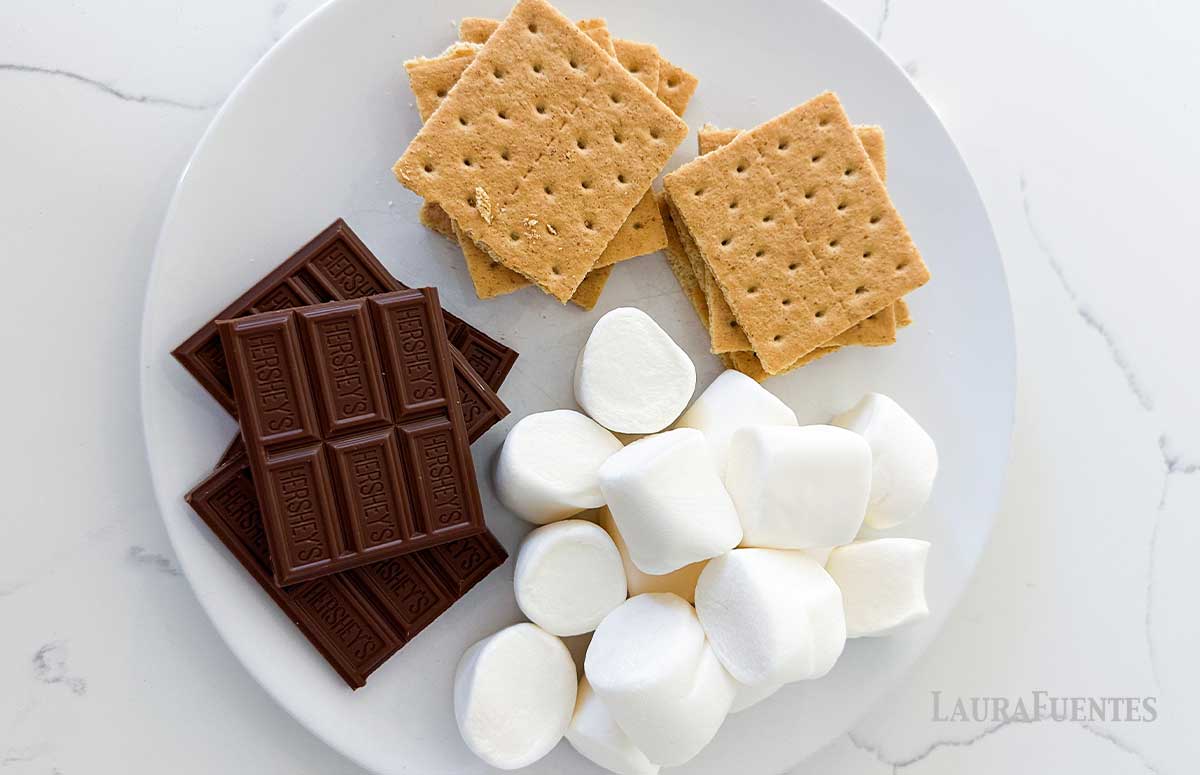 smores ingredients on a white plate