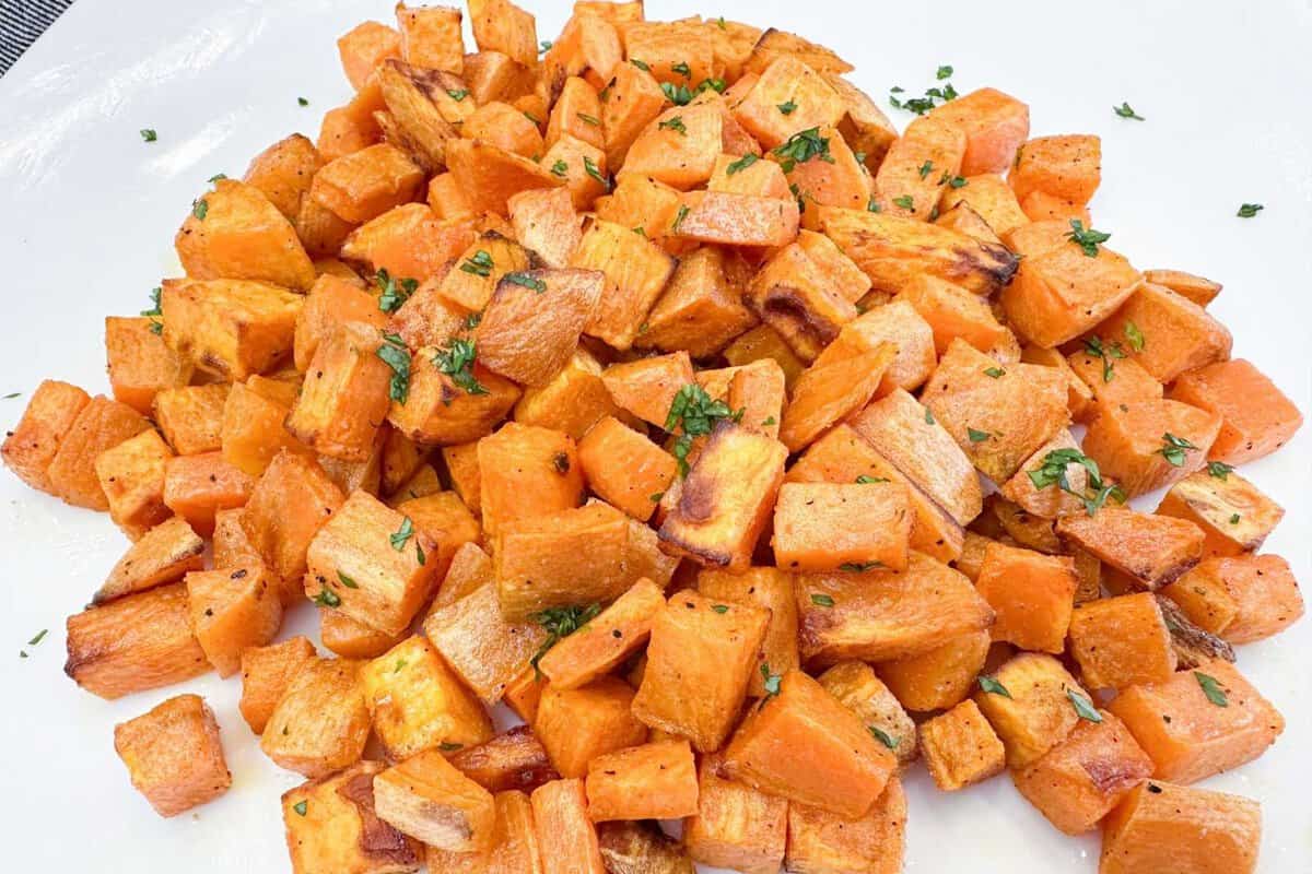 air fried sweet potatoes cubes on a white plate