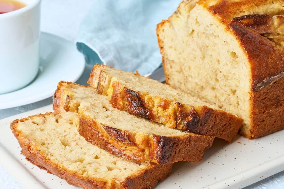 sliced moist banana bread bread loaf on a cutting board
