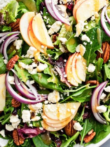 christmas salad with apples, pecans, greens and onion