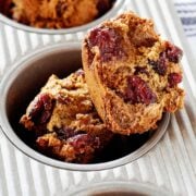 cranberry orange muffin in a muffin tin