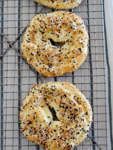 top view of two cloud bread bagel over a cooling rack
