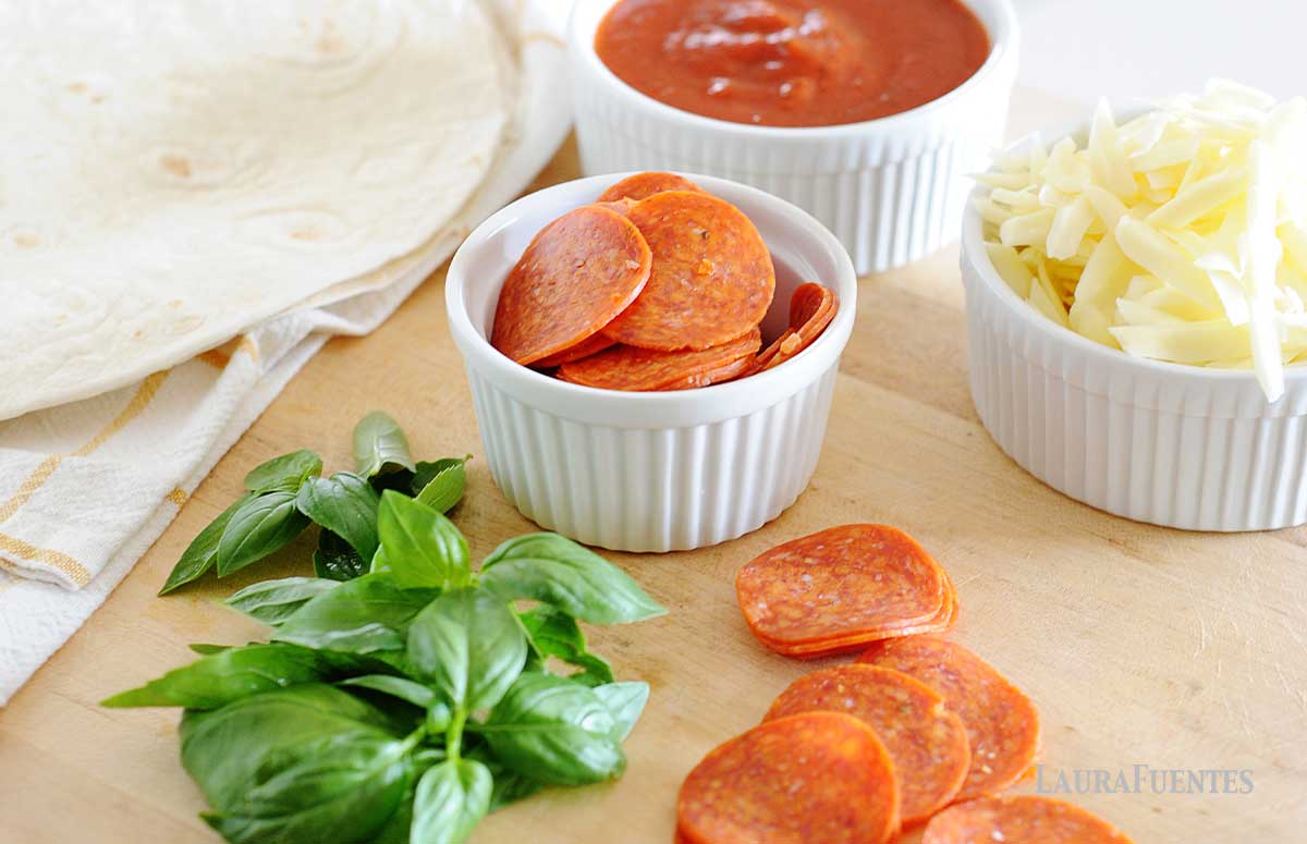 ingredients for tortilla pizza on a countertop