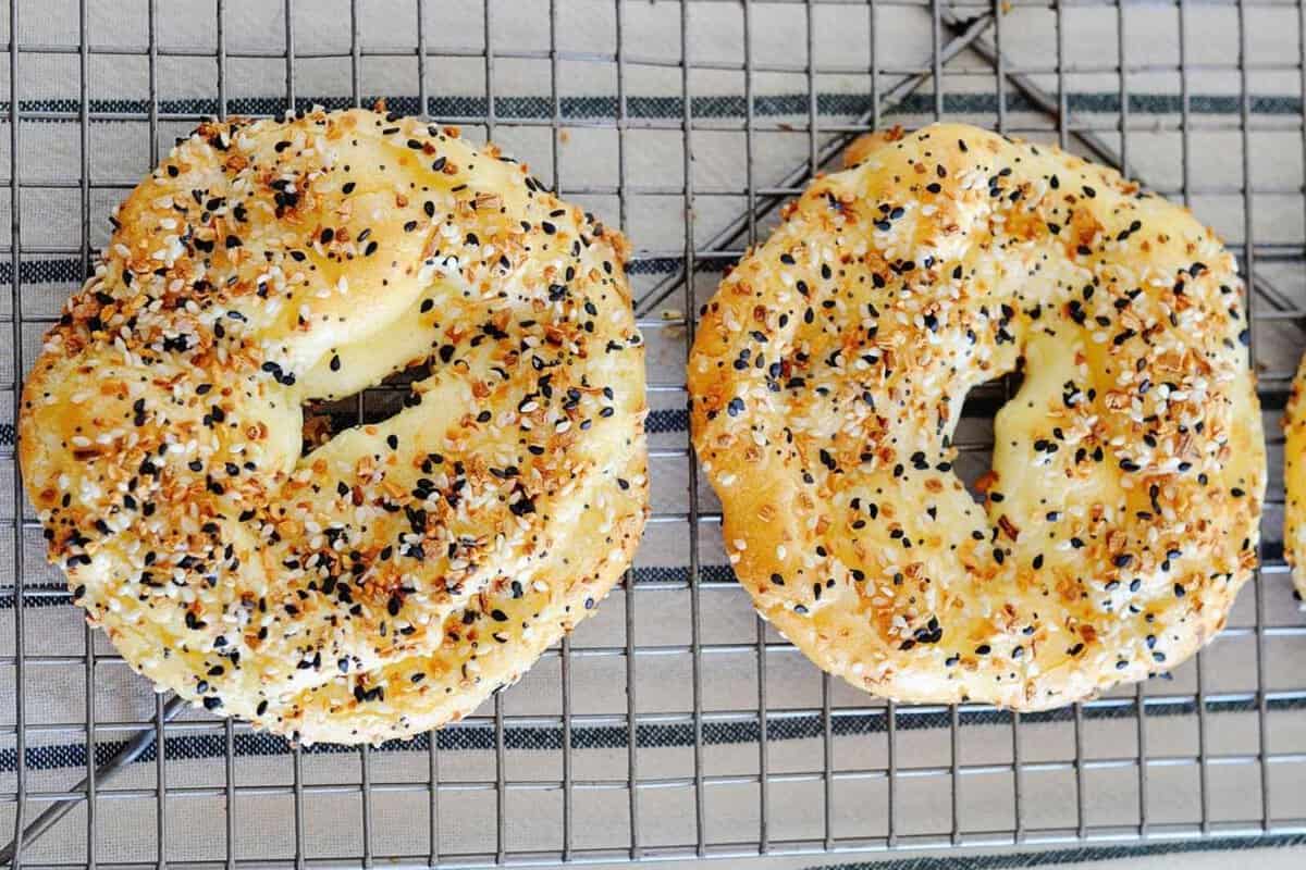 top view of two cloud bread bagel over a cooling rack