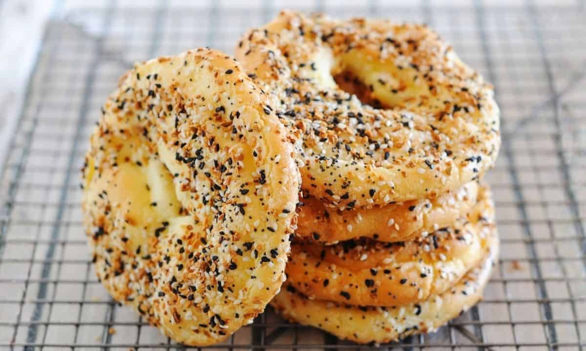 cloud bread bagel stacked over a cooling rack