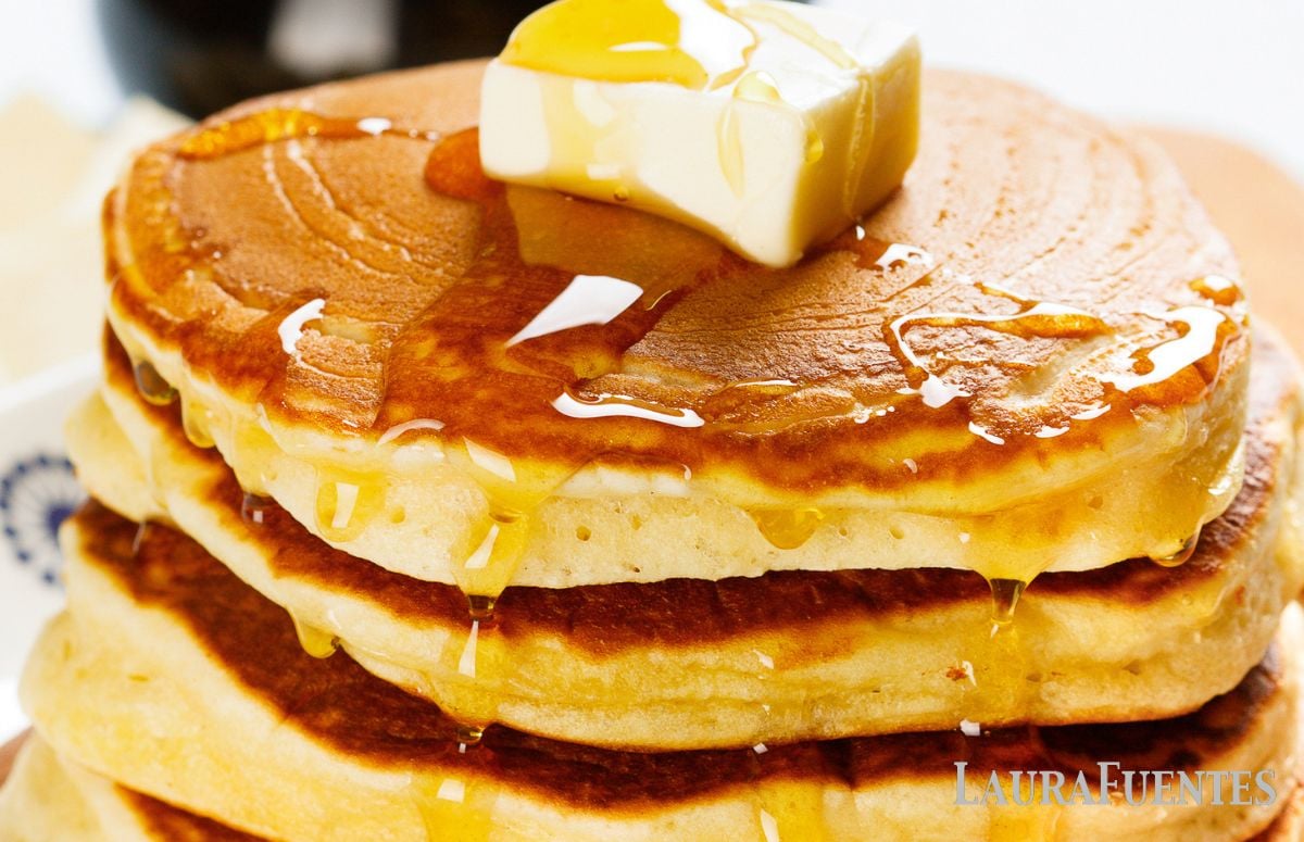 stack of homemade aunt Jemima pancakes with syrup and butter