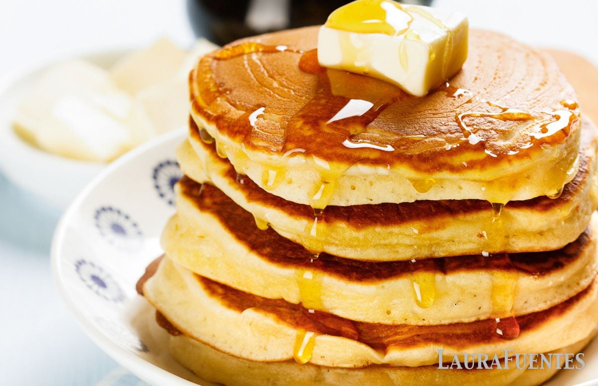 stack of homemade aunt Jemima pancakes with syrup and butter