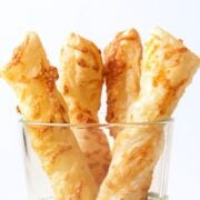 four cheese twists in a glass container for serving