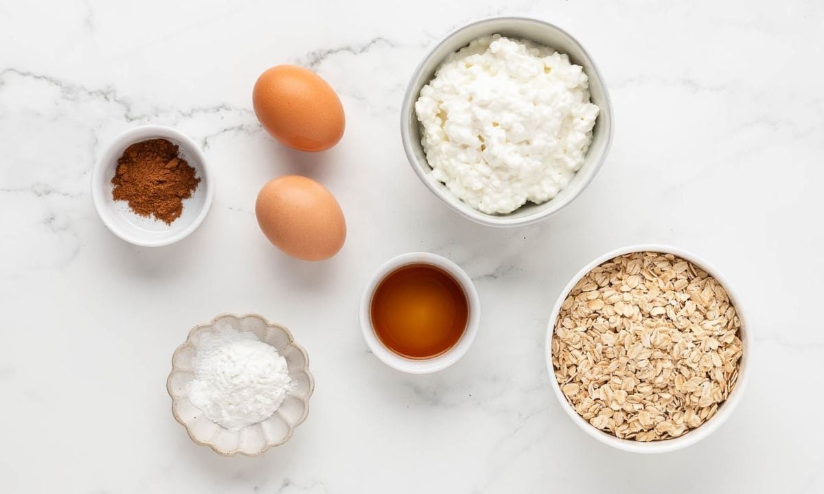 overhead view of ingredients needed to make an oatmeal pancake recipe with cottage cheese