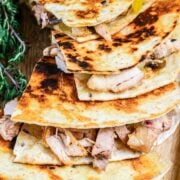 rotisserie chicken quesadillas over a wooden board