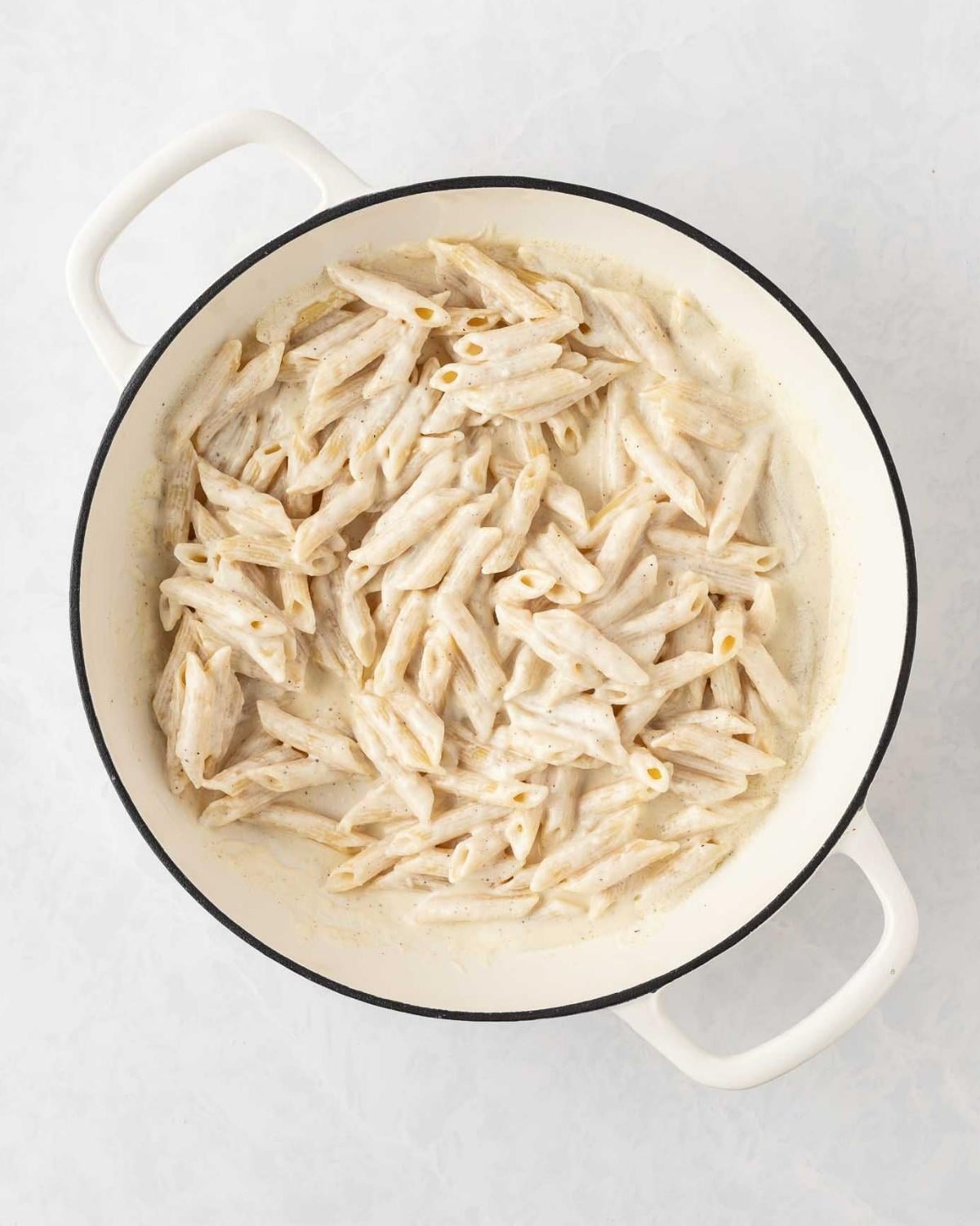 top view of creamy penne alfredo in a pot