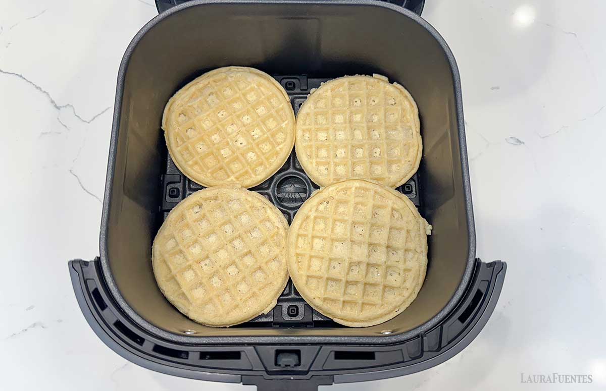 four frozen waffles in an air fryer