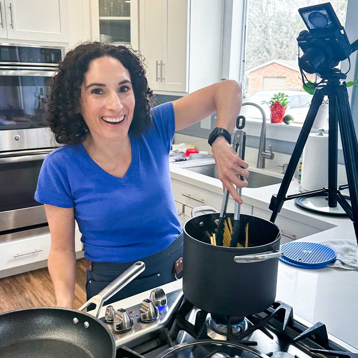 Laura Fuentes Cooking in the kitchen on camera