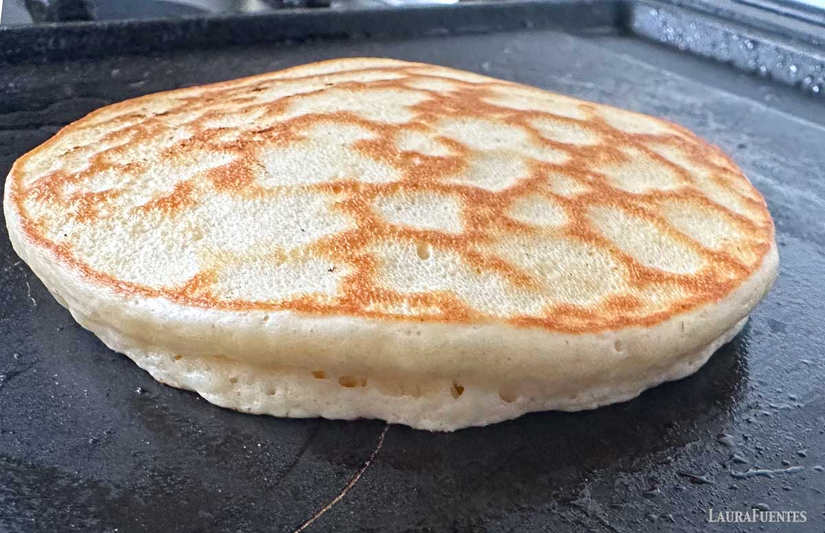 pancakes without baking powder cooking on a griddle