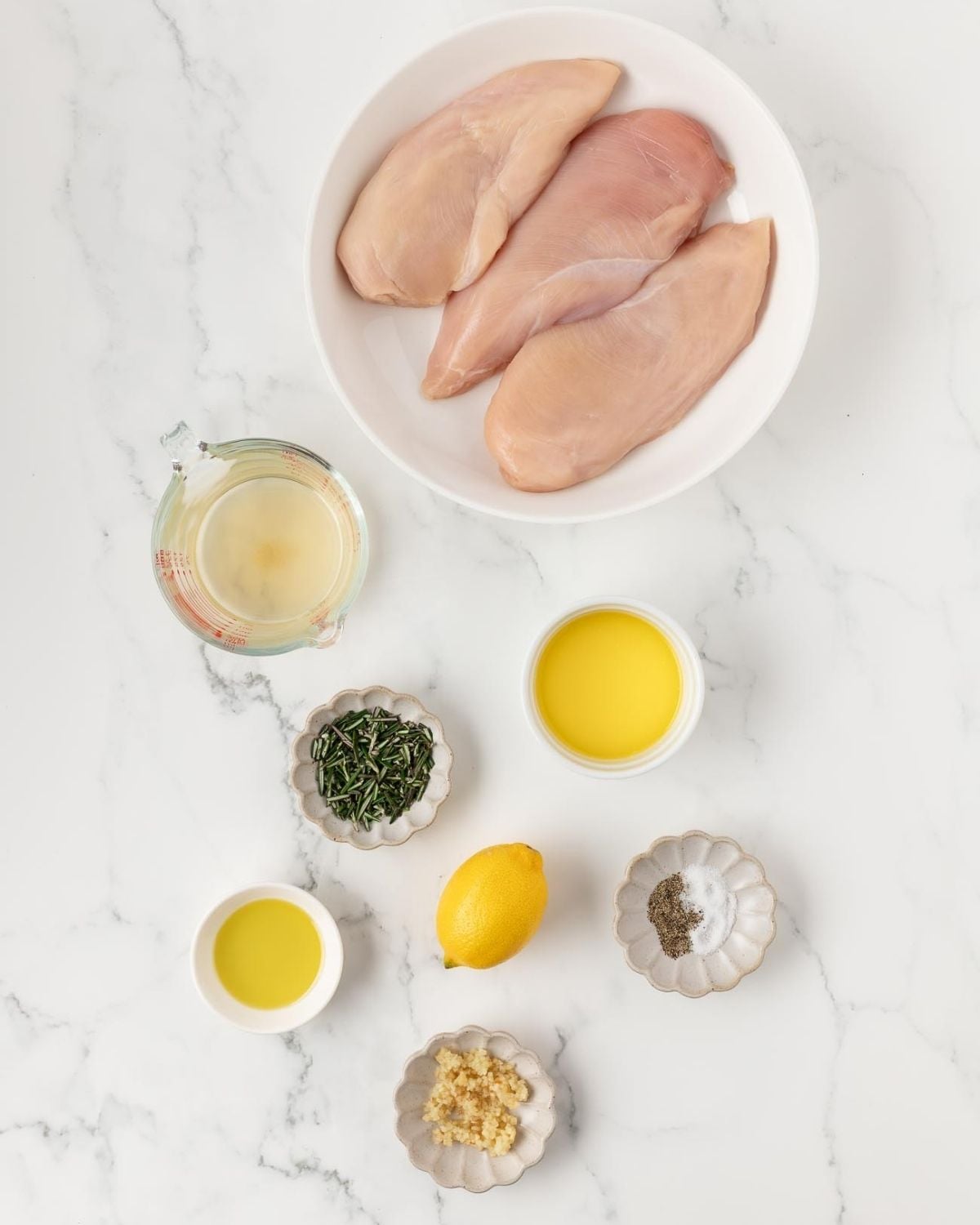 overhead view of ingredients needed for making rosemary chicken breasts recipe