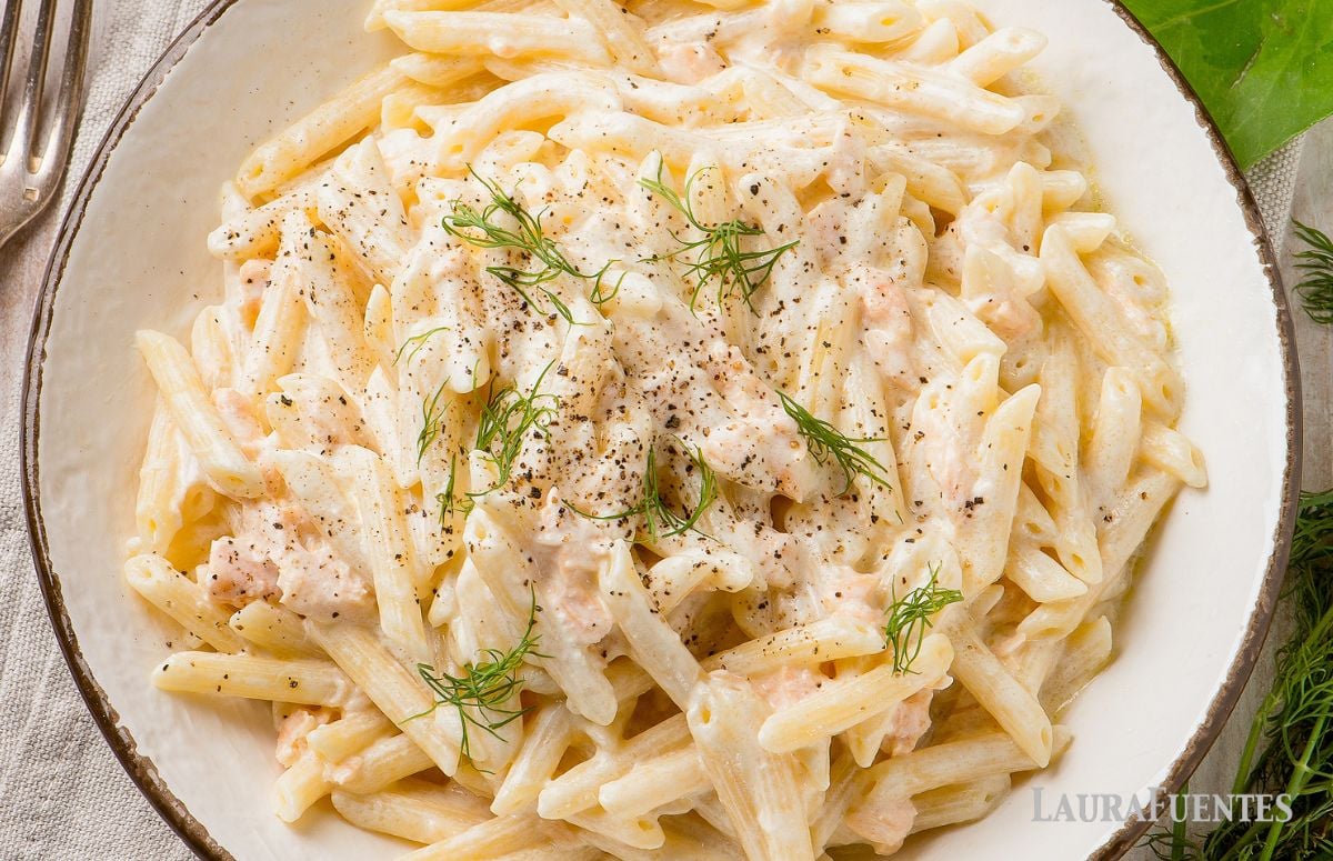 large plate of penne alfredo with salmon