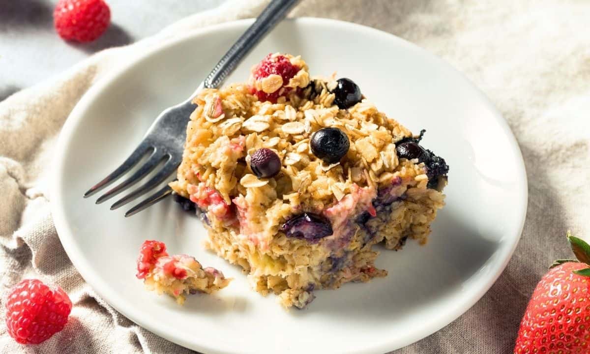 a serving of baked protein oatmeal with berries in a dish