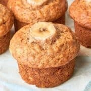 one banana muffin surrounded by other muffins