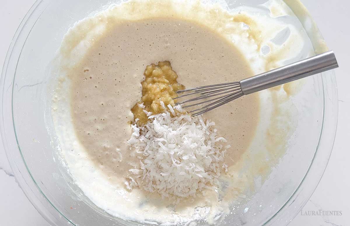 mixing banana coconut pancake batter