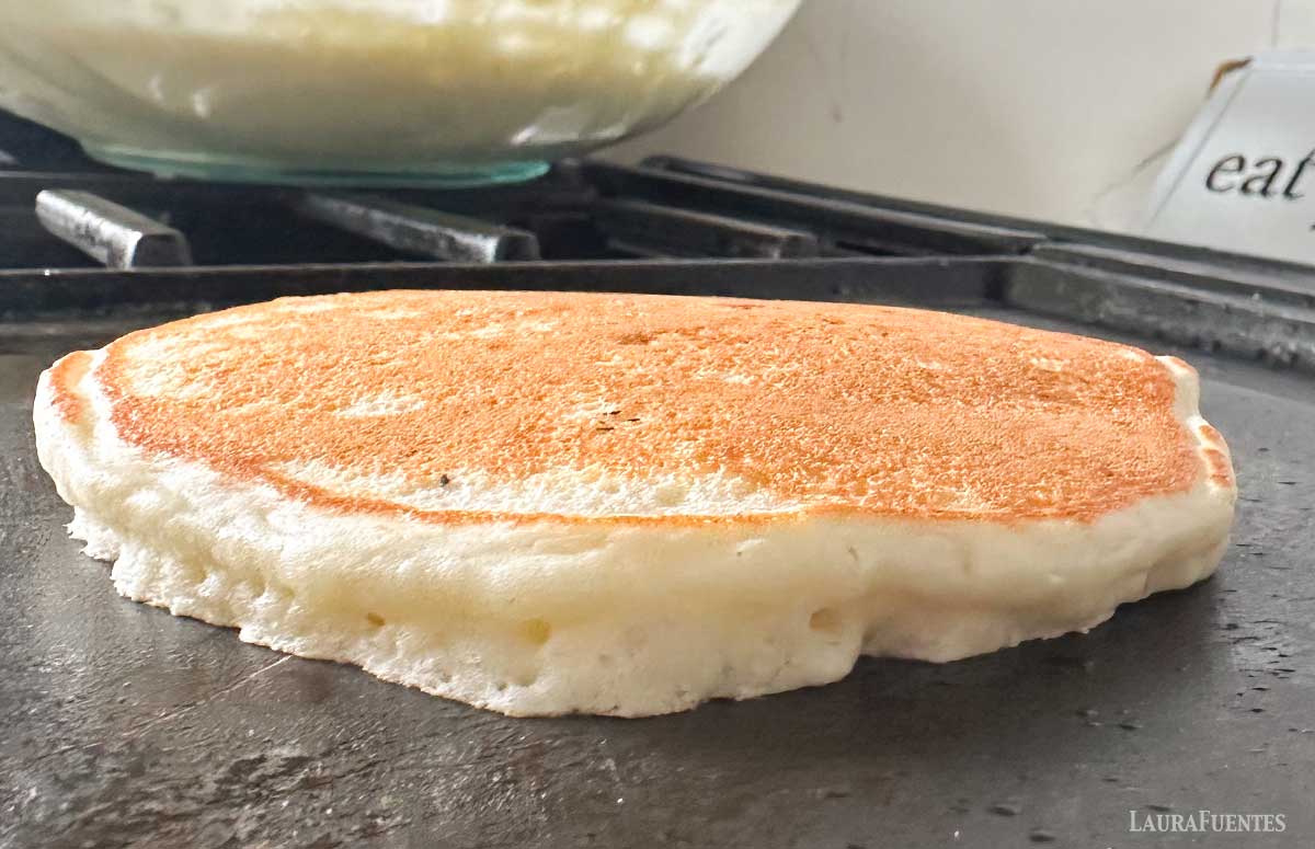 banana coconut pancake cooking on a grilled 