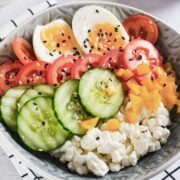 savory cottage cheese bowl with egg, cucumber, tomato, and bell pepper