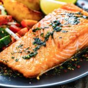 cooked salmon fillet served in a dish with veggies