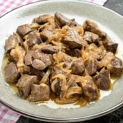 a dish with baked chicken livers and onion
