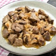 a dish with baked chicken livers and onion