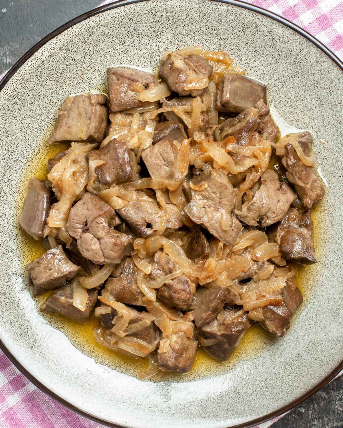 a dish with baked chicken livers and onion