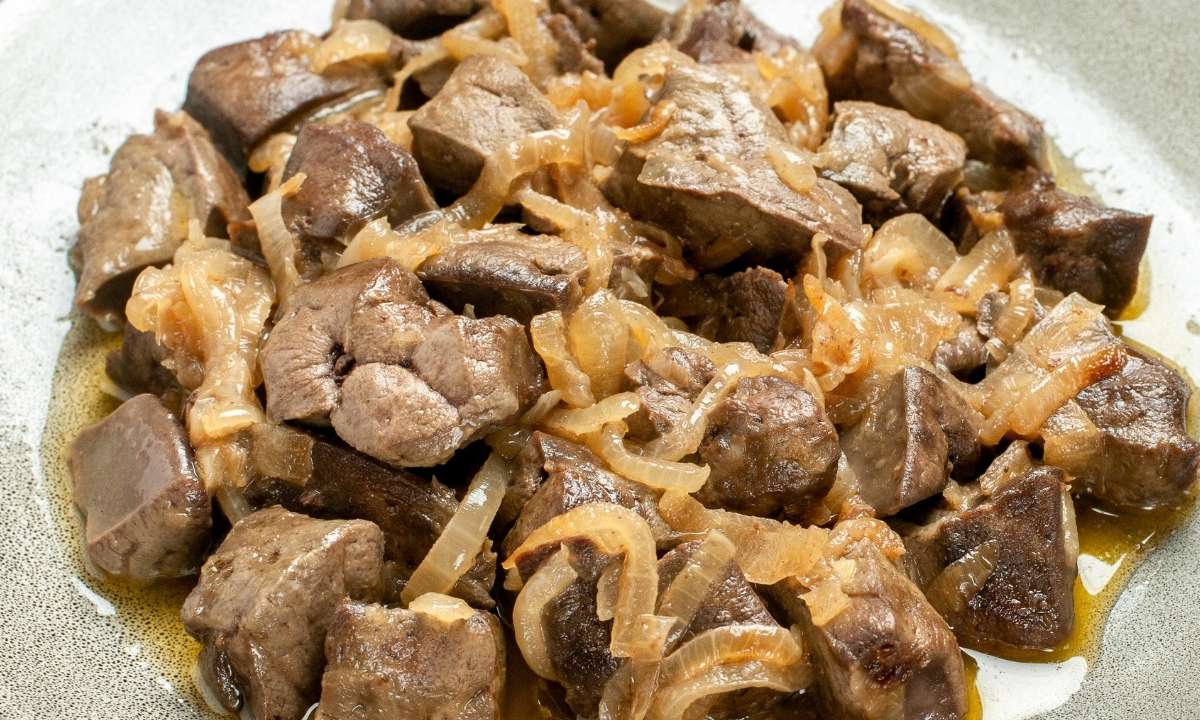 a dish with baked chicken livers and onion