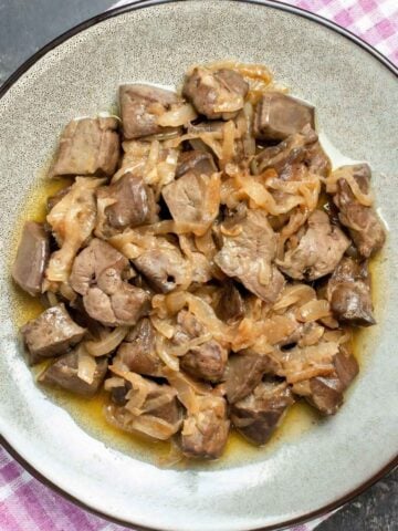 a dish with baked chicken livers and onion