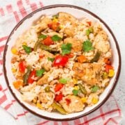 top view of rotisserie chicken and rice rice with veggies