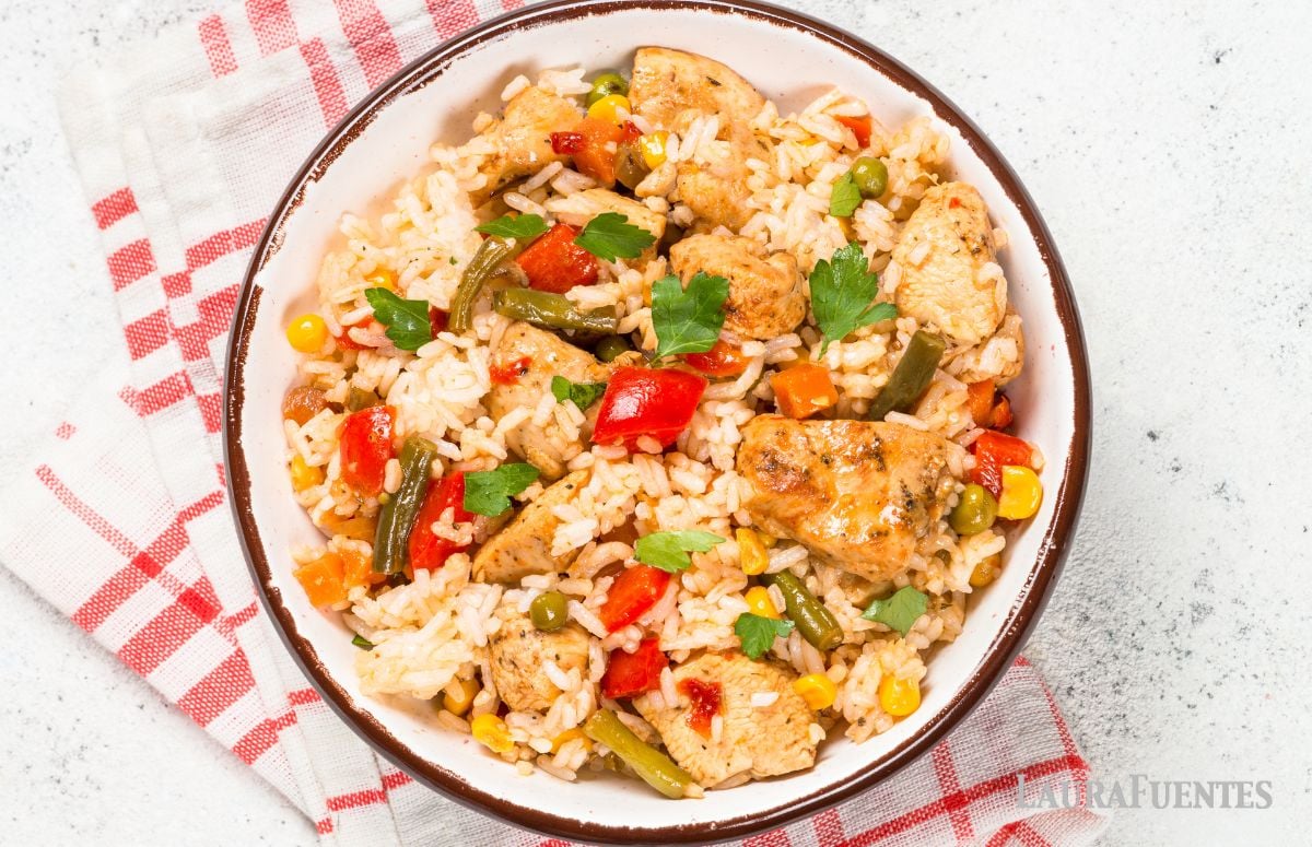 top view of rotisserie chicken and rice rice with veggies