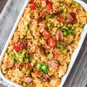 top view of cajun chicken & rice in a baking dish