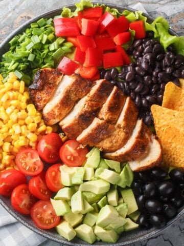 a sliced chicken breast of a Mexican salad
