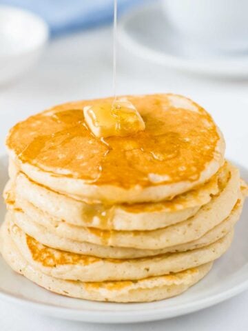 stack of pancakes on a white plate
