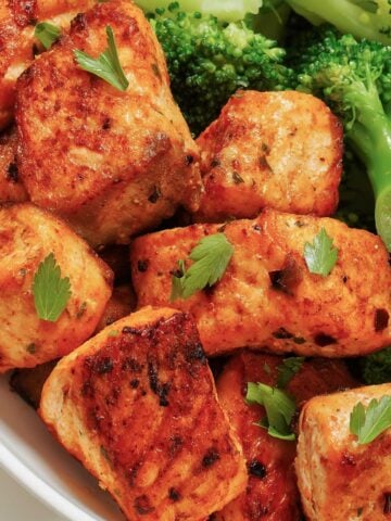 close up of salmon bites with broccoli
