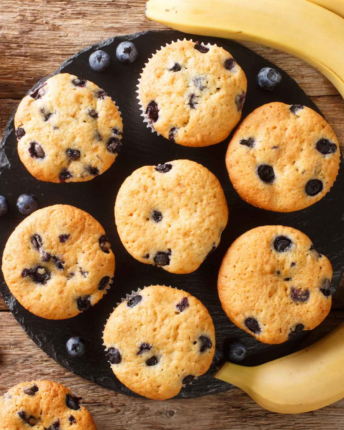 top view of seven banana blueberry muffins