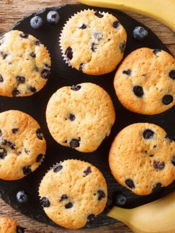 top view of seven banana blueberry muffins