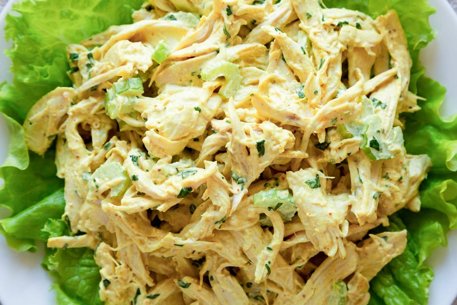 Curried chicken salad over a bed of greens