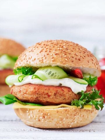 a chicken burgers on a white dish