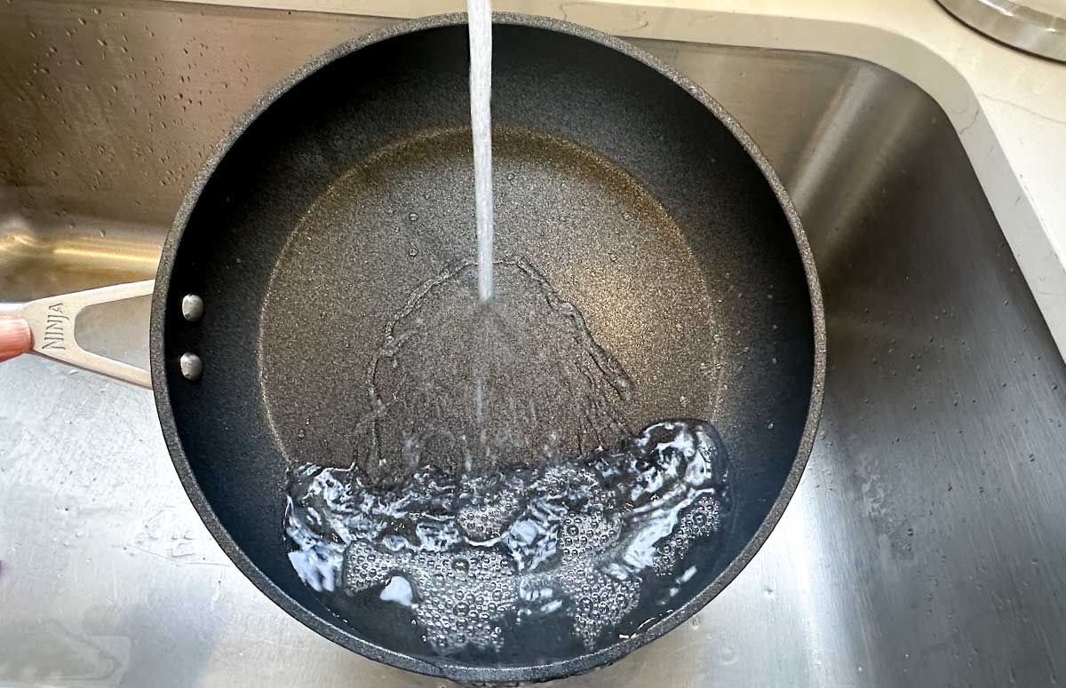 hot pan with water pouring on it