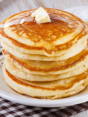 stack of three pancakes on a single plate