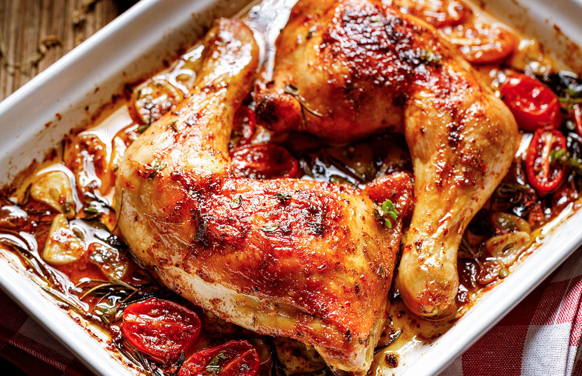 two baked chicken leg quarters
