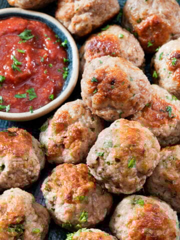 top view of chicken meatballs with marinara sauce