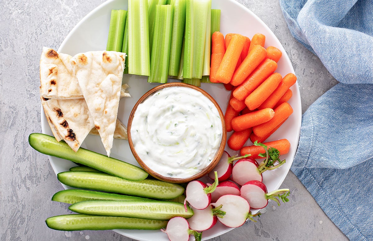 veggie platter with a ranch cottage cheese dip in the middle
