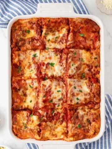 overhead view of a rectangular baking dish with oven baked lasagna made with cottage cheese
