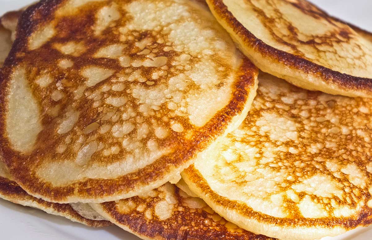 crackled pancakes in a pile on a plate